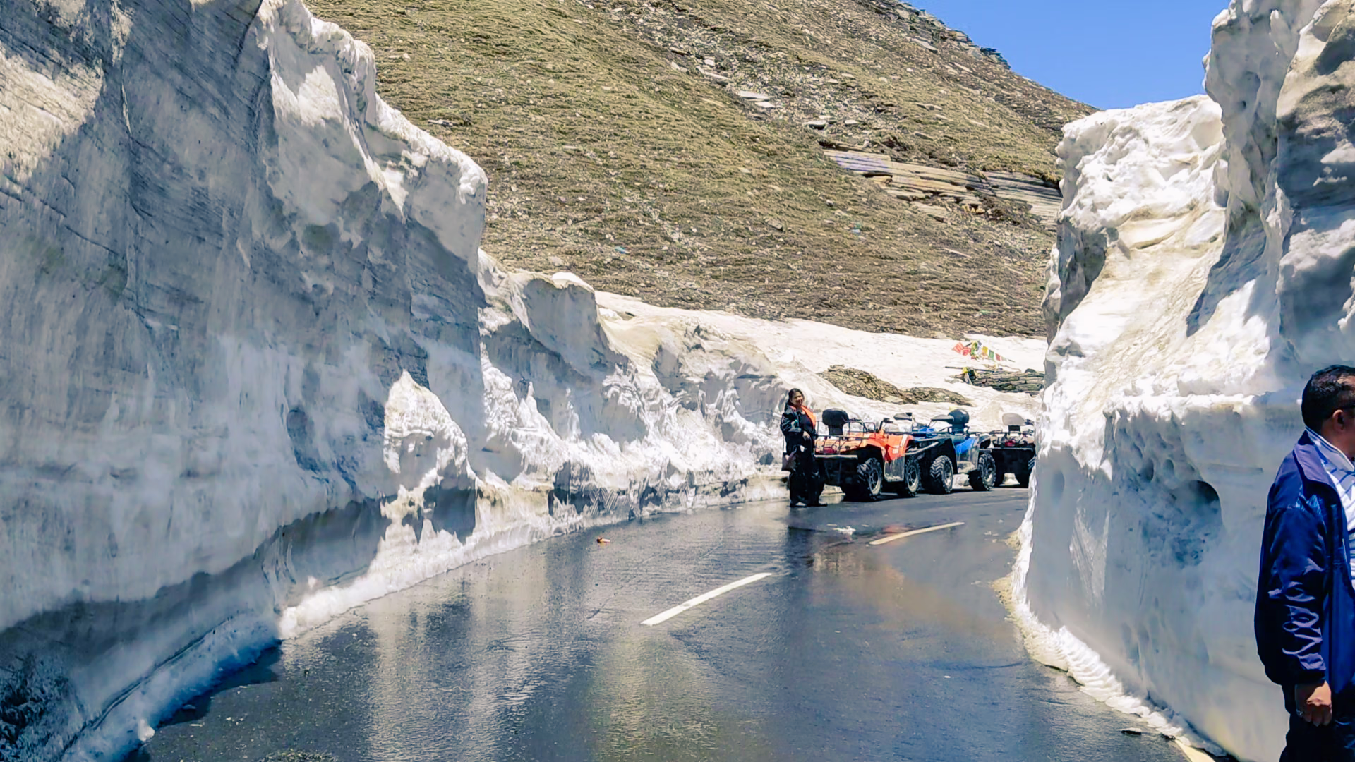 Very tall walls of ice on both sides of the road